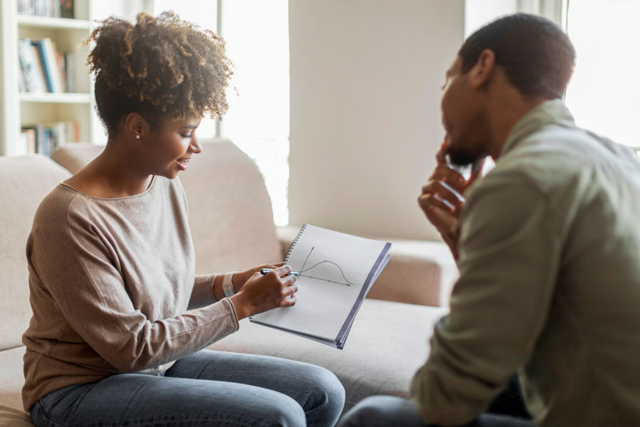 man with anxiety talking to a therapist