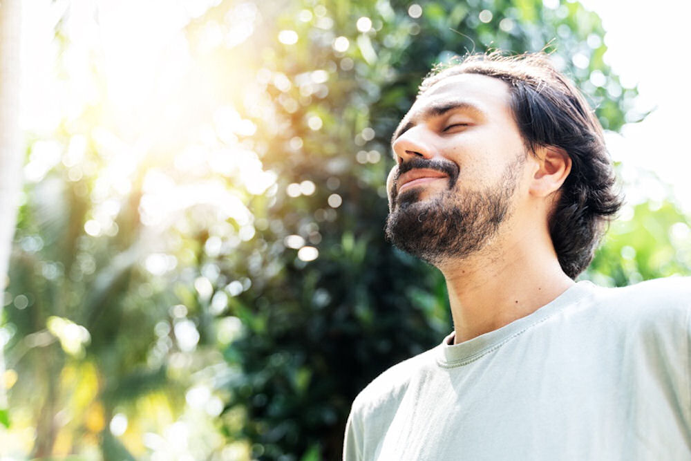 a-man-smiling-in-nature-happy