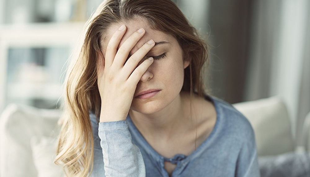 woman-stressed-head-in-hand