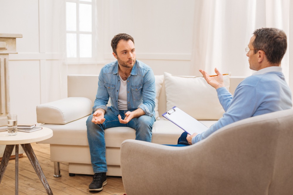 Therapist discussing effective coping skills for anxiety with a client.