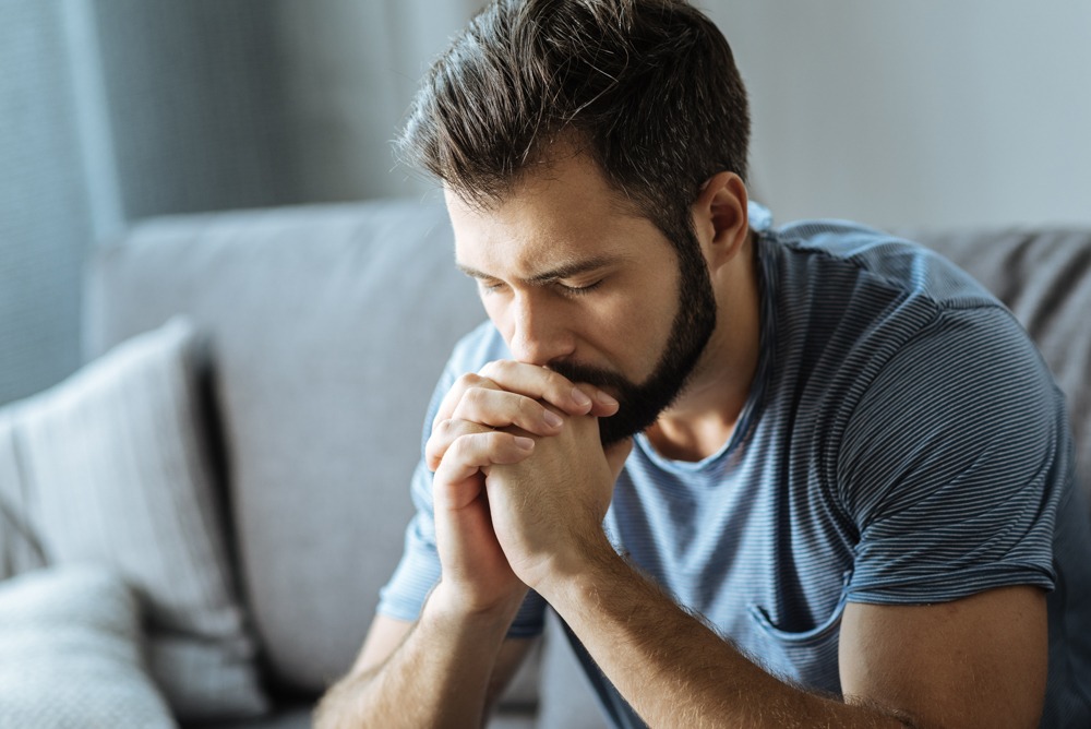 Man practicing mindfulness and reflection as coping skills for anxiety