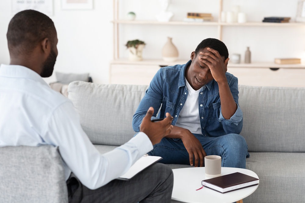 man with depression in therapy