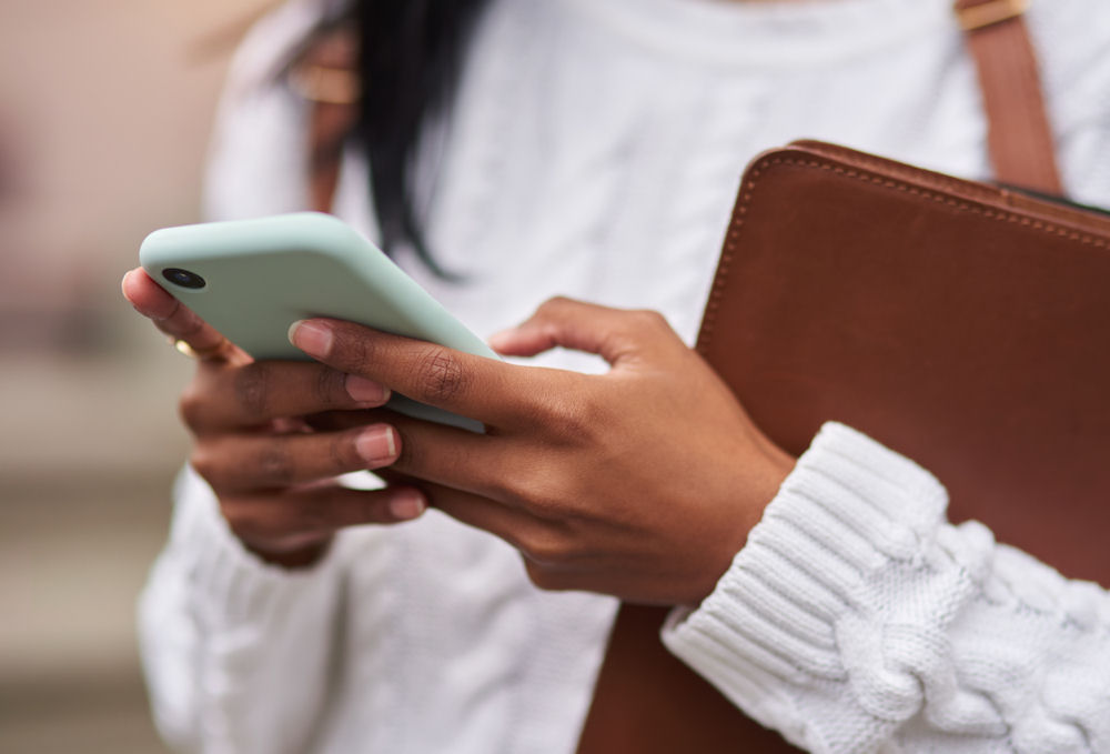 woman contacting rehab on her phone