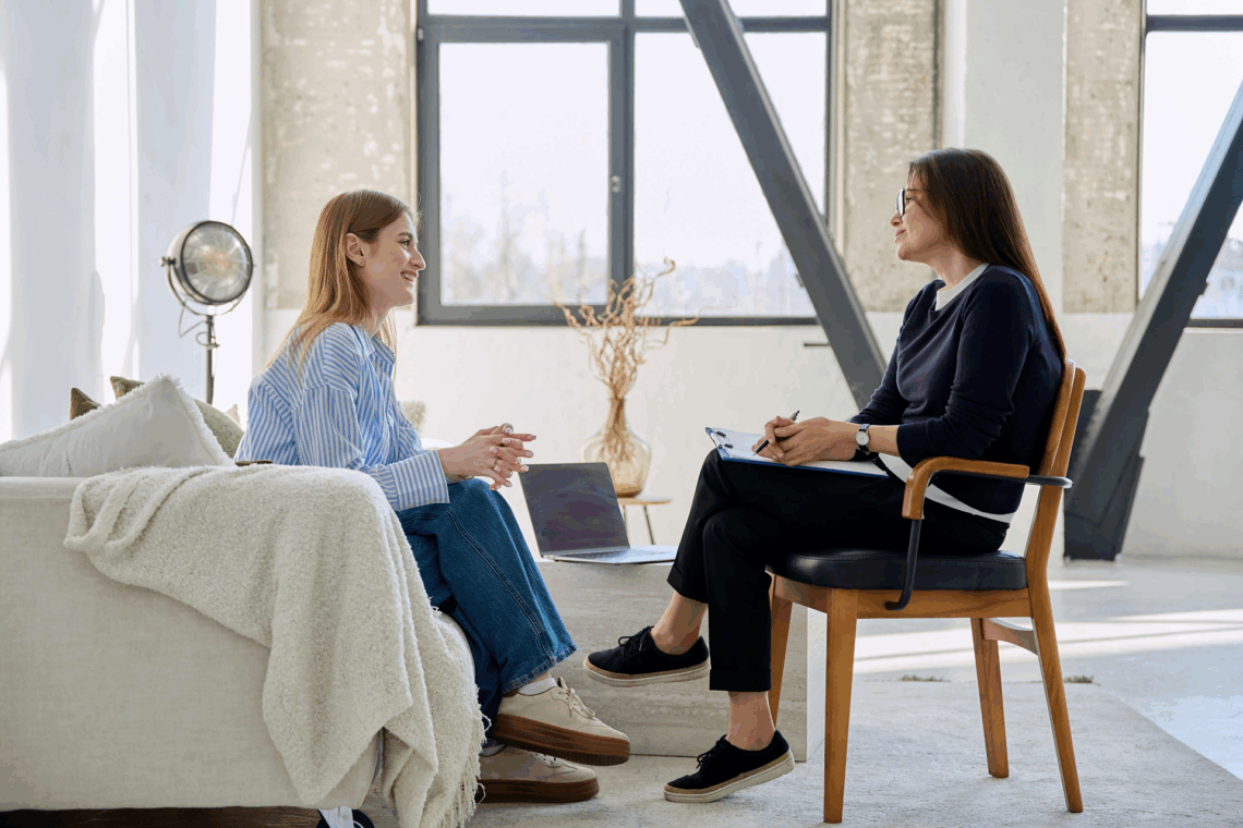 Therapist and client in a safe, supportive session highlighting trauma-informed care.