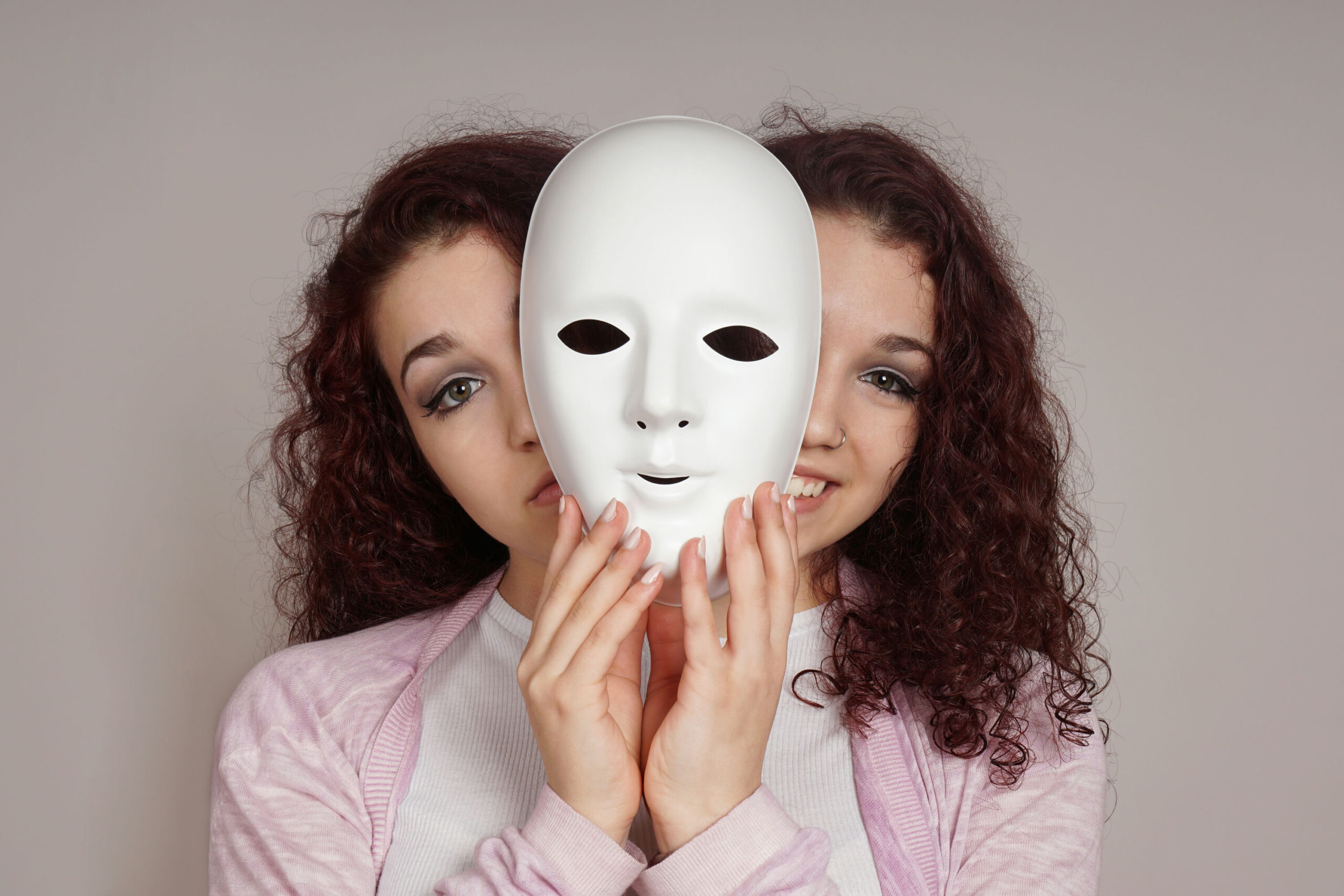 Illustration of bipolar disorder showing contrasting moods: mania with high energy and depression with sadness.