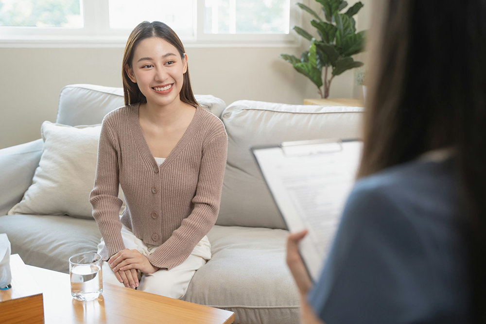 woman in therapy talking to therapist about recovery from eating disorder