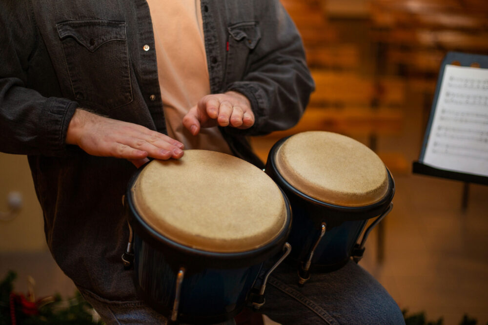 healing-with-music-therapy man drumming as part of music therapy treatment used in PTSD and trauma recovery programs