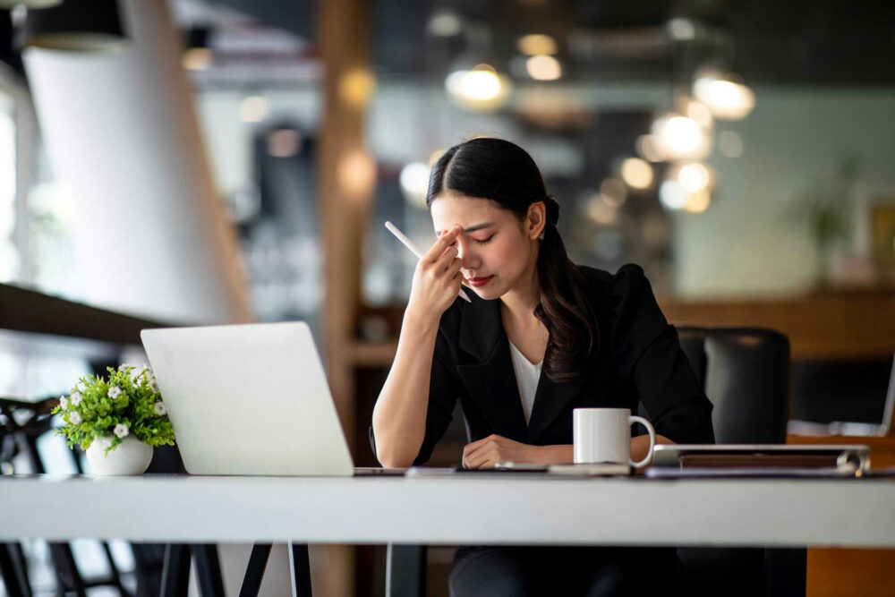 financial-stress-in-college-students College student balancing a part-time job and coursework due to financial pressure