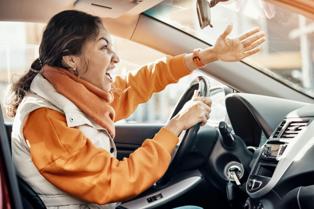 signs-you-may-have-anger-issues woman experiencing road rage while driving, a common stressor that can contribute to anger problems