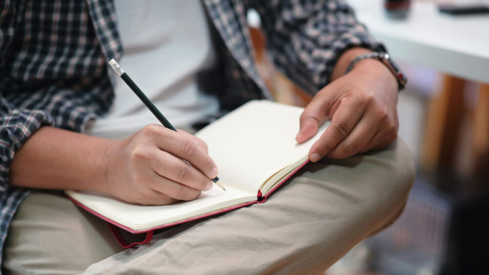 preventing-eating-disorder-relapse-recovery-tips person journaling to reflect on thoughts and emotions during eating disorder recovery.