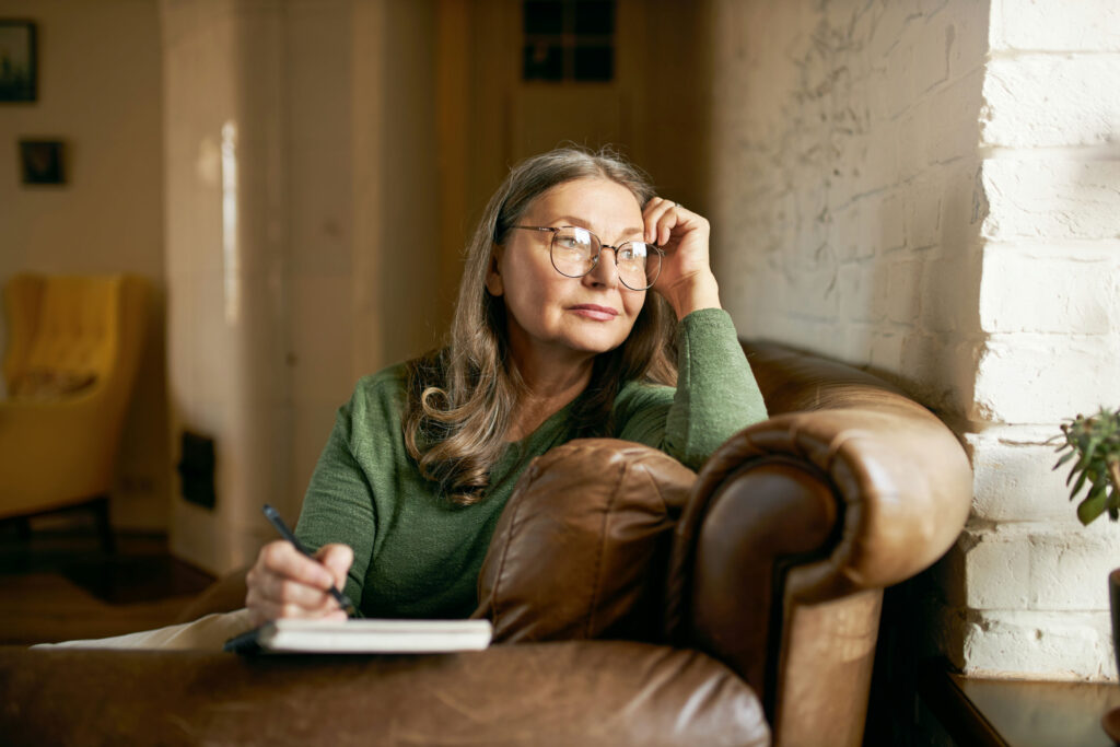 Woman journaling while reflecting after experiencing emotional manipulation and gaslighting